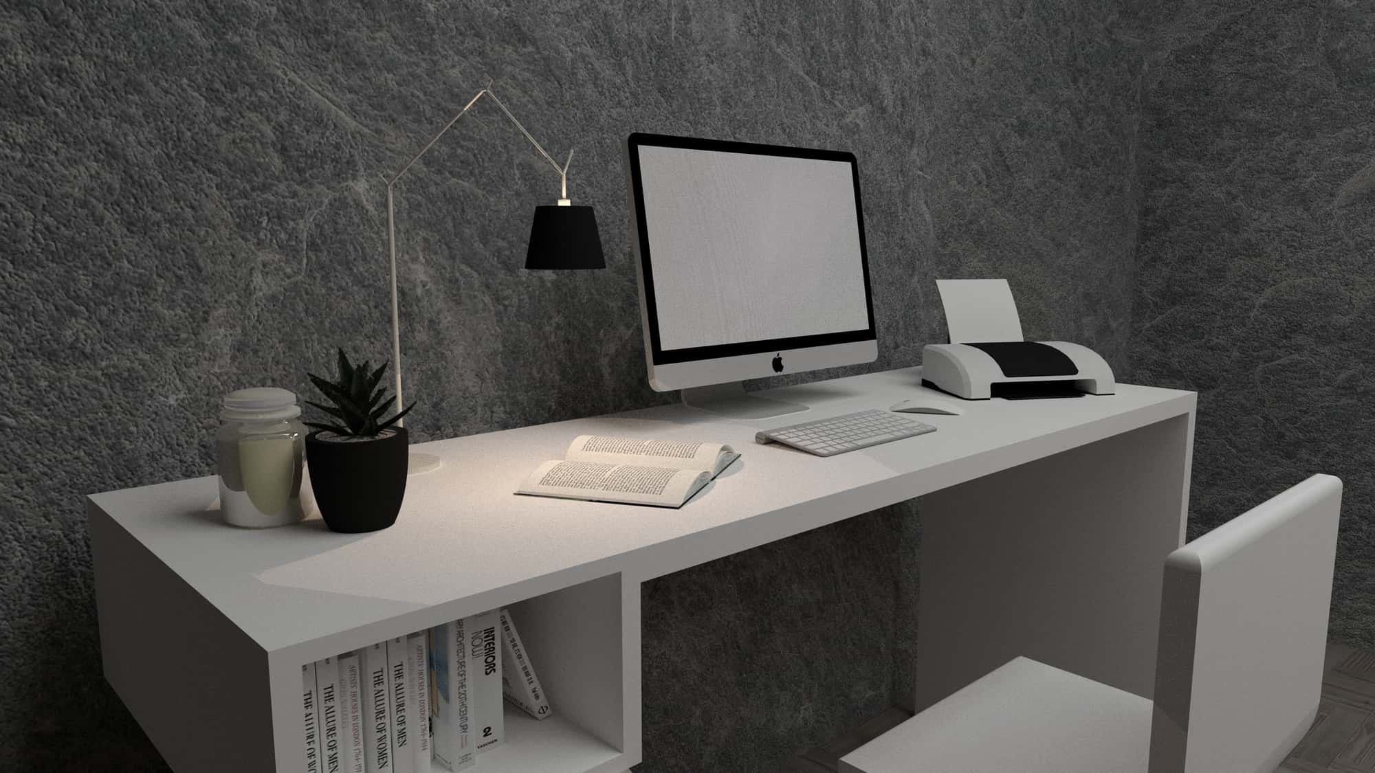 A white desktop computer on a white table