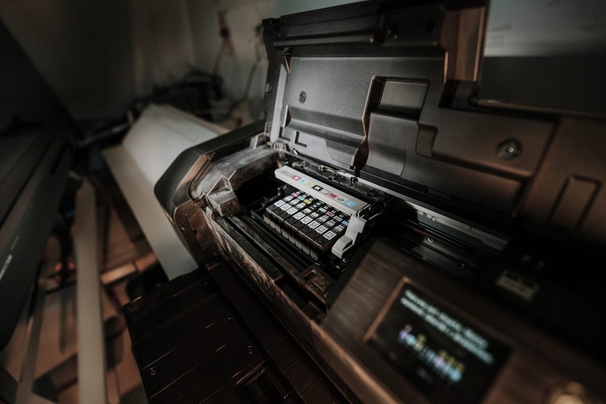 A close view of an inkjet printer with its cartridges exposed